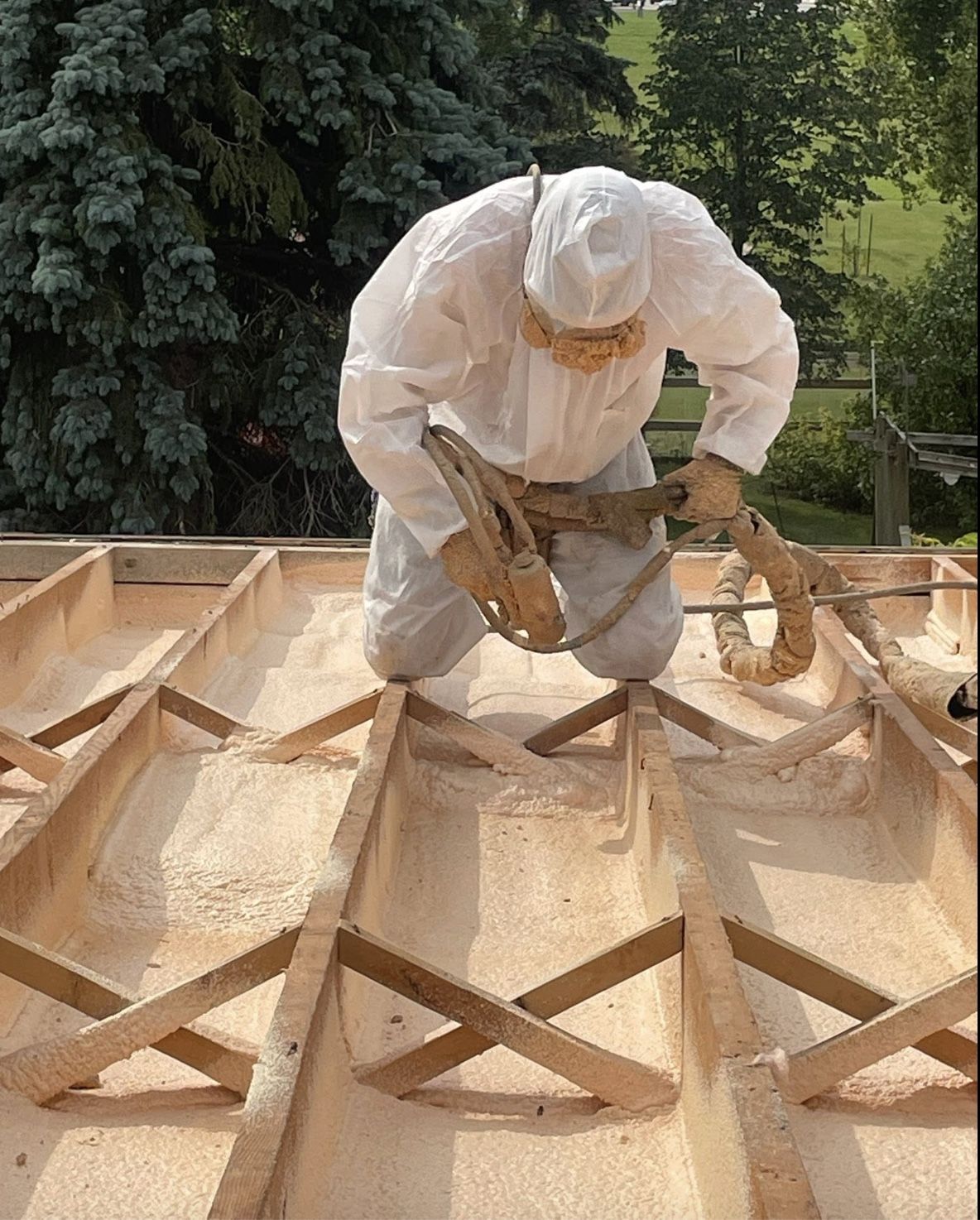 Flat roof deck exterior having 3lb spray foam roofing applied
